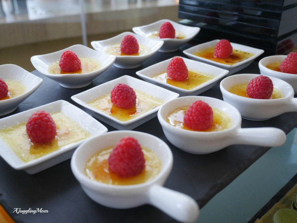Creme brulee topped with raspberry