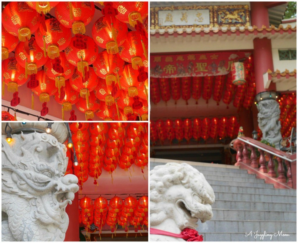 A pair of dragon figurine and lion statue stands guard at the temple entrance